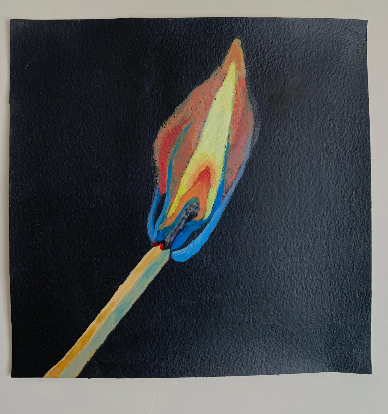 Pintura de una cerilla encendida sobre fondo negro